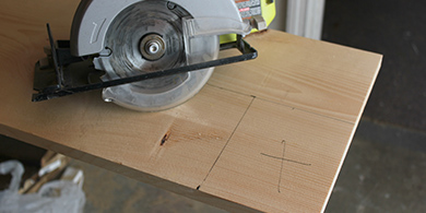 saw cutting notches in wood for shelving