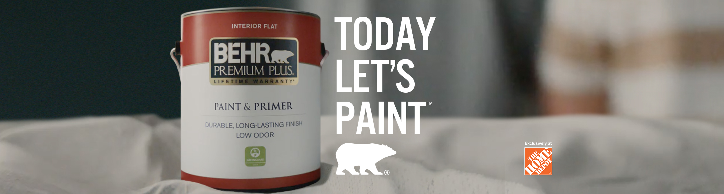Person getting ready to paint with a can of BEHR Premium Plus Flat interior paint and the words Today Let's Paint in the foreground.