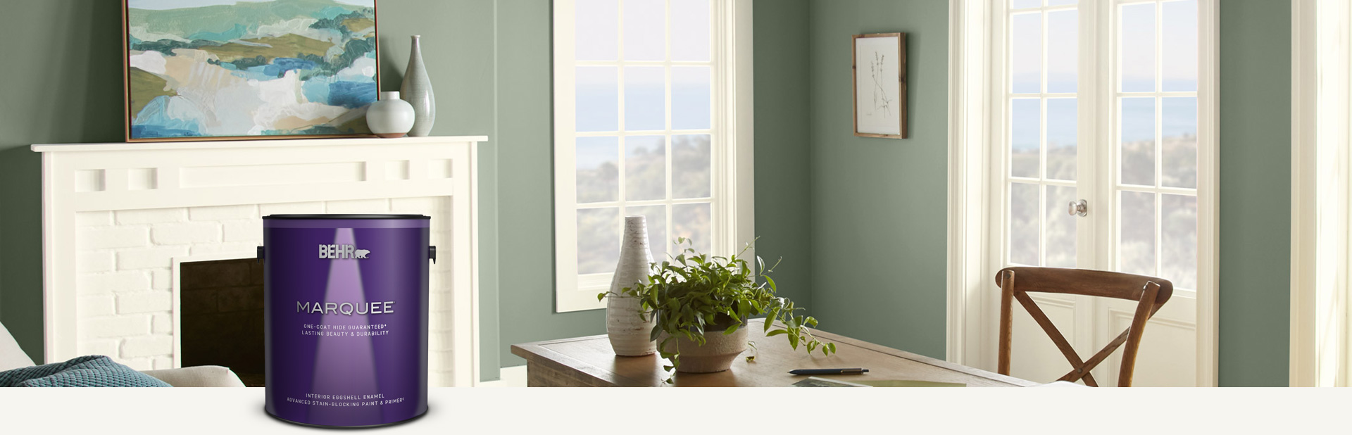Dining room with muted green walls and a can of Marquee Interior Eggshell Enamel paint in the foreground
