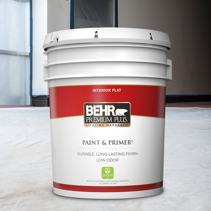 A close up shot of a 1 gallon BEHR Premium Plus Interior Flat being stirred by a contractor.