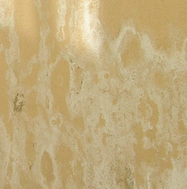 Close up image of patterned cracking in the surface of the paint film resembling the scales of an alligator.