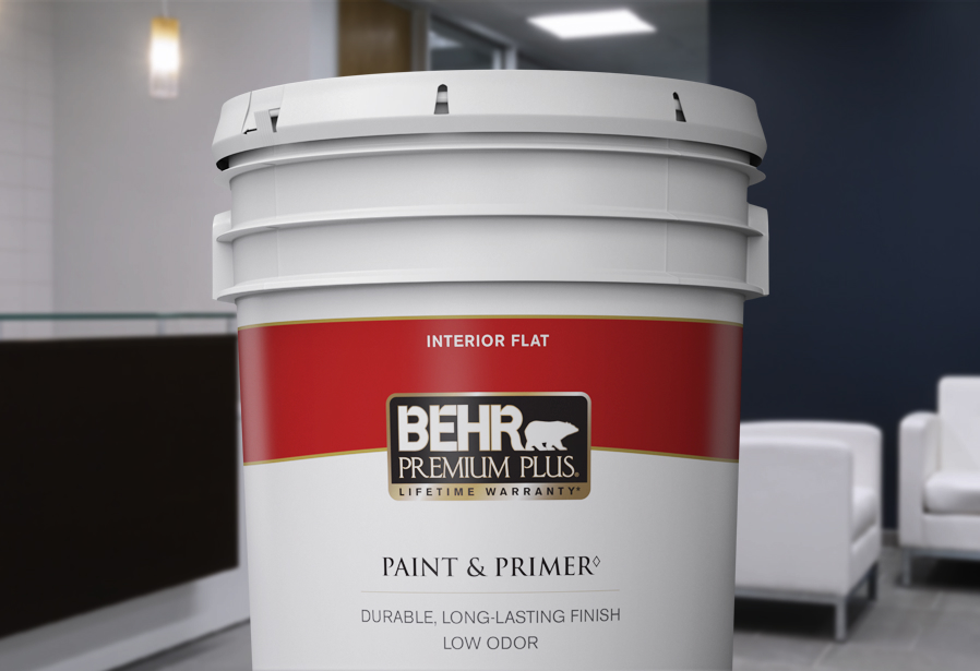 Image of a 5 gallon can shot of BEHR PREMIUM Plus Interior flat. The background is of a reception area.