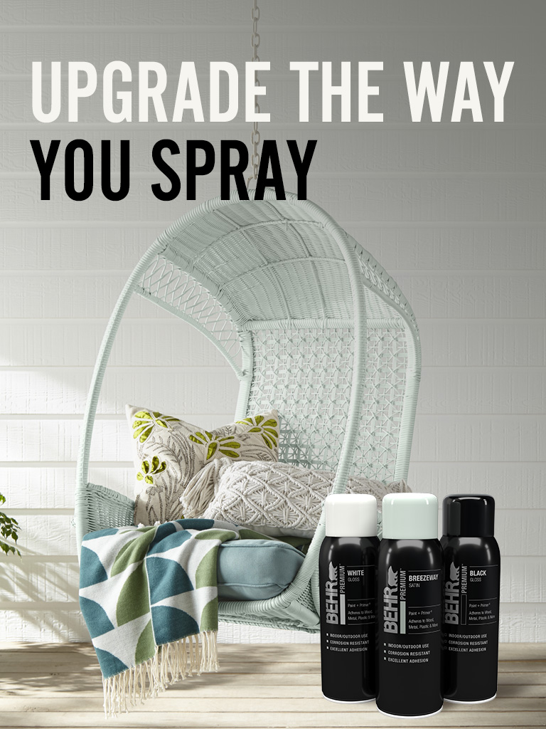 Mobile-sized image of Behr Premium Spray paint cans with a chair in the background and text overlay that says Upgrade the way you spray.
