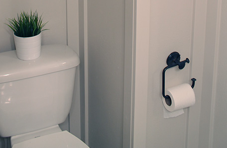 A new toilet paper holder and trim add nice detail to the corner