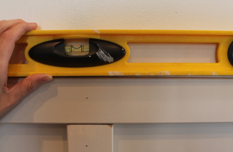 Make sure the trim is level when you attach it to the wall