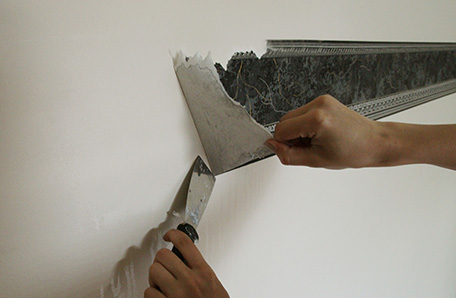 wallpaper border being removed from wall