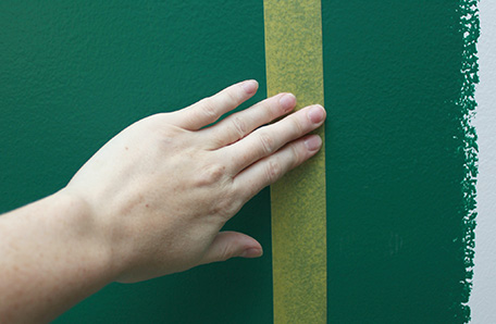 Apply delicate-surface painter’s tape along the line