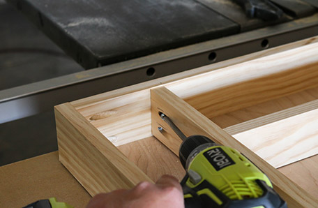 pieces of wood frame being attached with drill