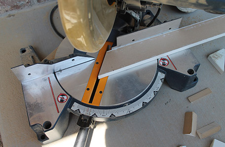 Cutting the trim boards to match the angle of the stairs