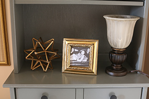 main shelf of finished hutch with decor