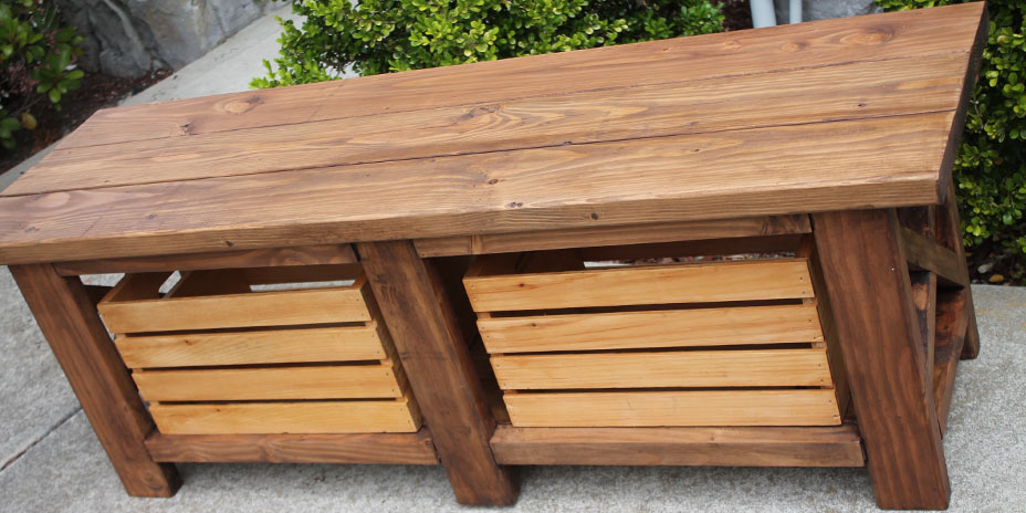 finished wooden bench with pull out storage crates