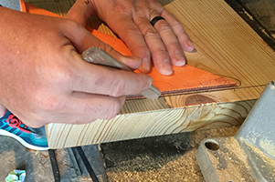 Draw a line for the pilot holes using a framing square
