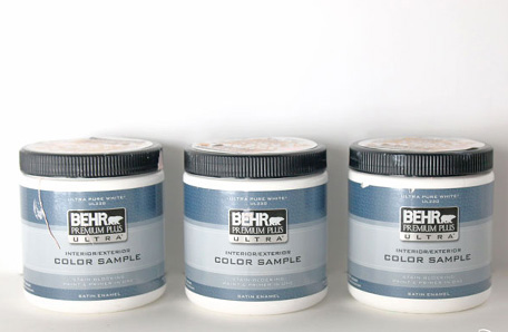 three sample cans of paint