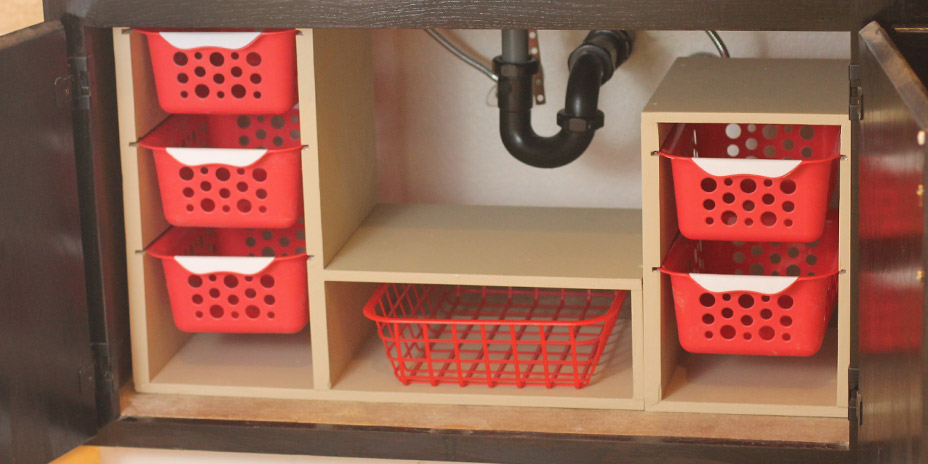 finished undersink storage with sliding bins and tray