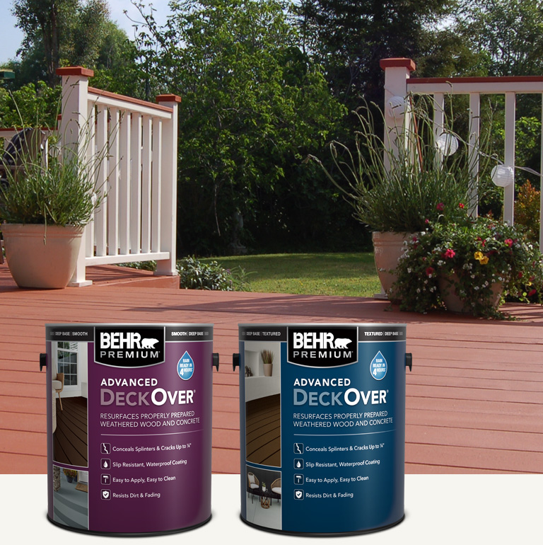 Two cans of Behr Premium Advanced DeckOver Coating with a wooden deck, product can, and brush in the background mobile