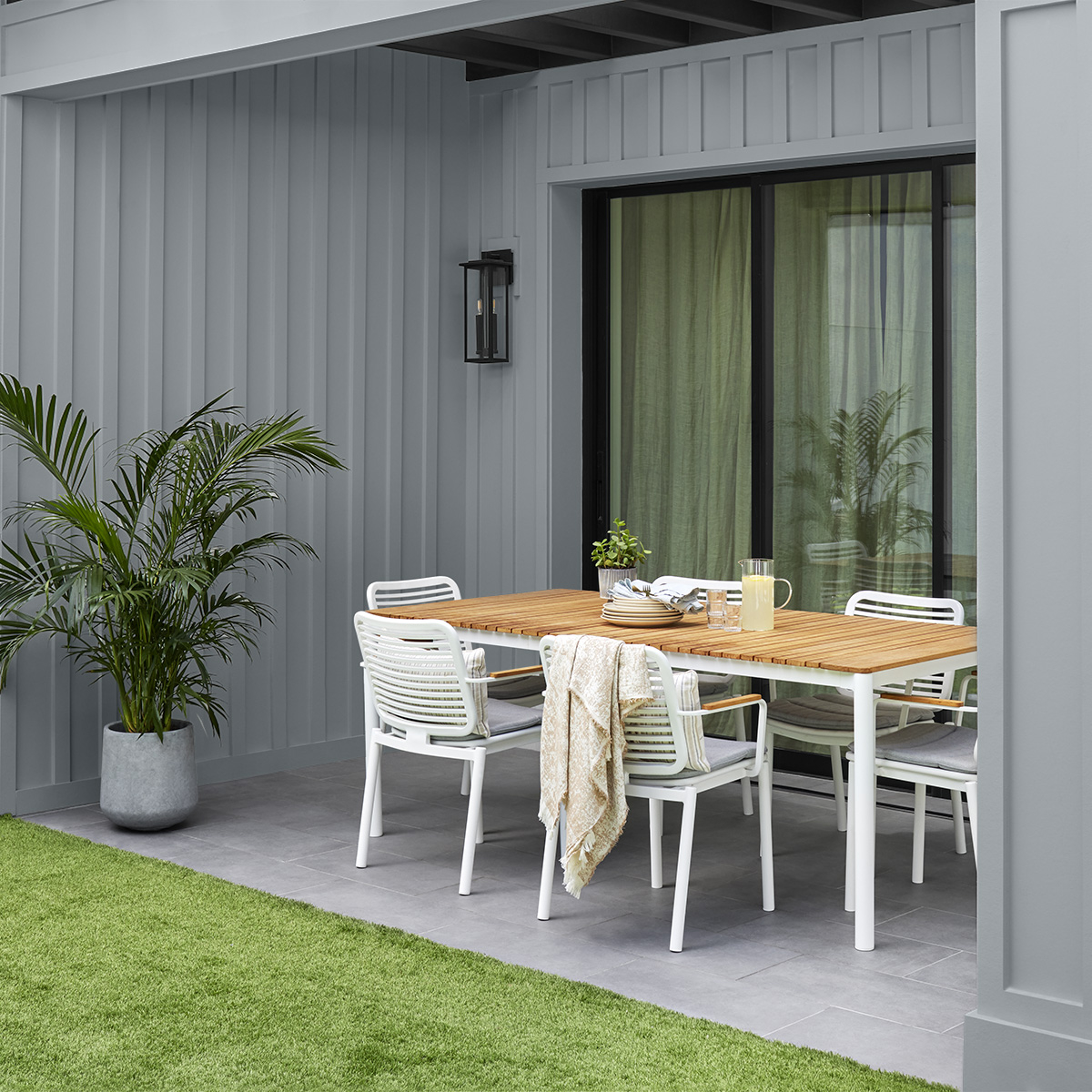 A blue gray back patio painted with Behr Dynasty Exterior paint