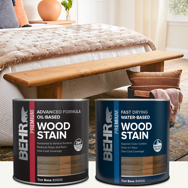 Two ladies sitting at stained dining table with Behr interior wood stain products in foreground mobile