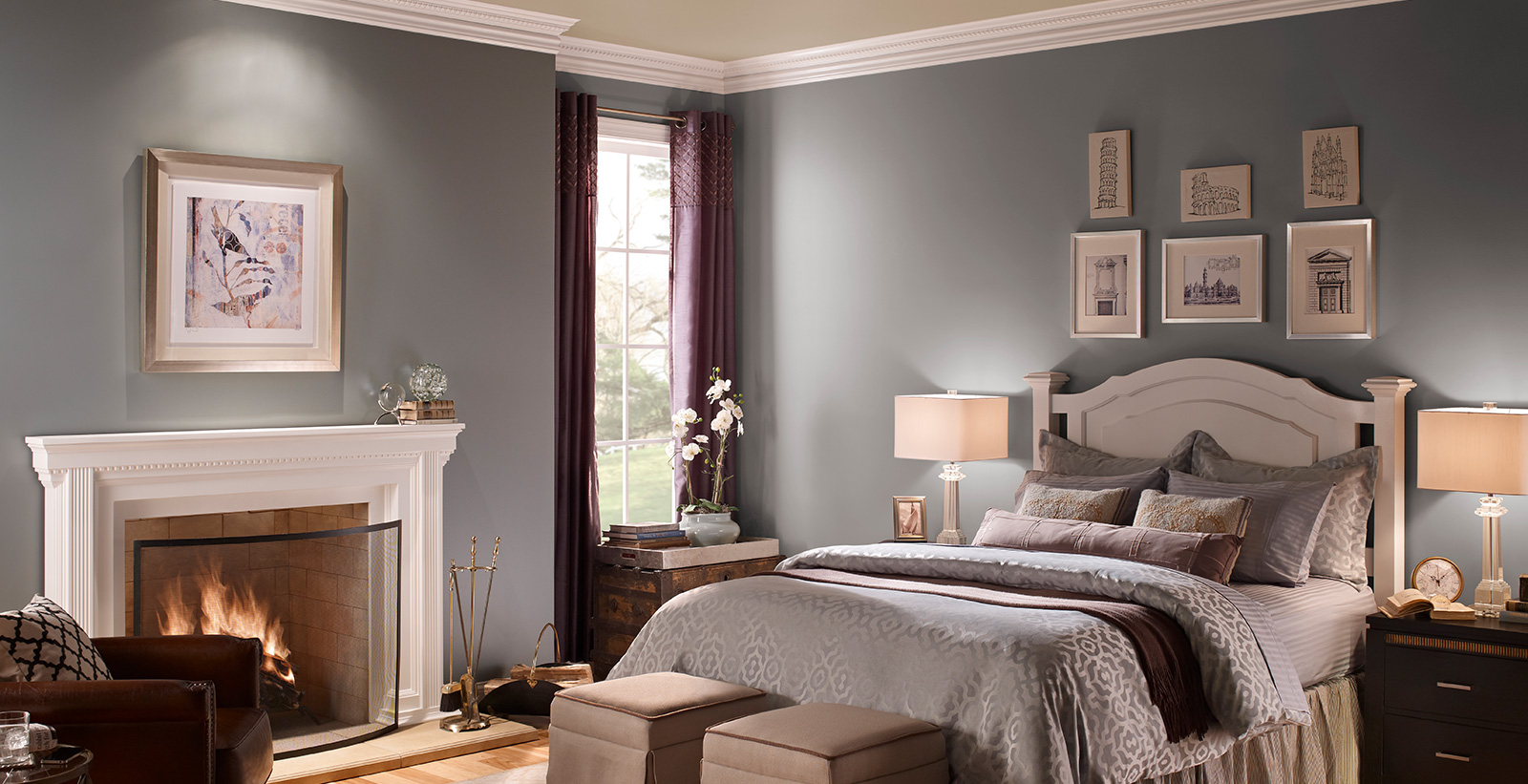 Classic bedroom with grayish blue on walls, white on trim and fireplace, and light tan on ceiling