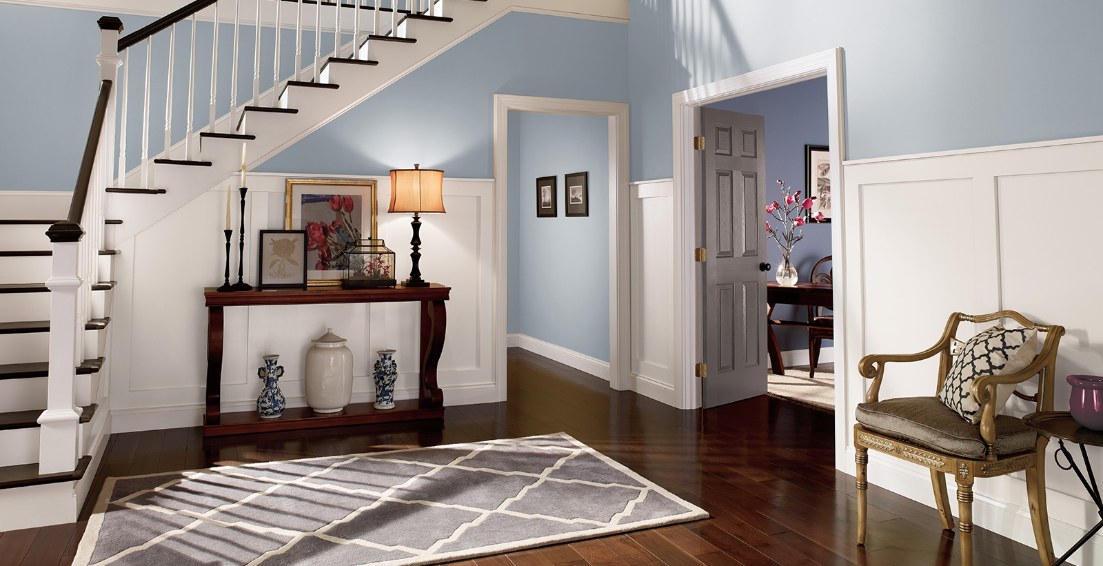 Relaxed Hallway with gray walls, white trim, and cool tone style.