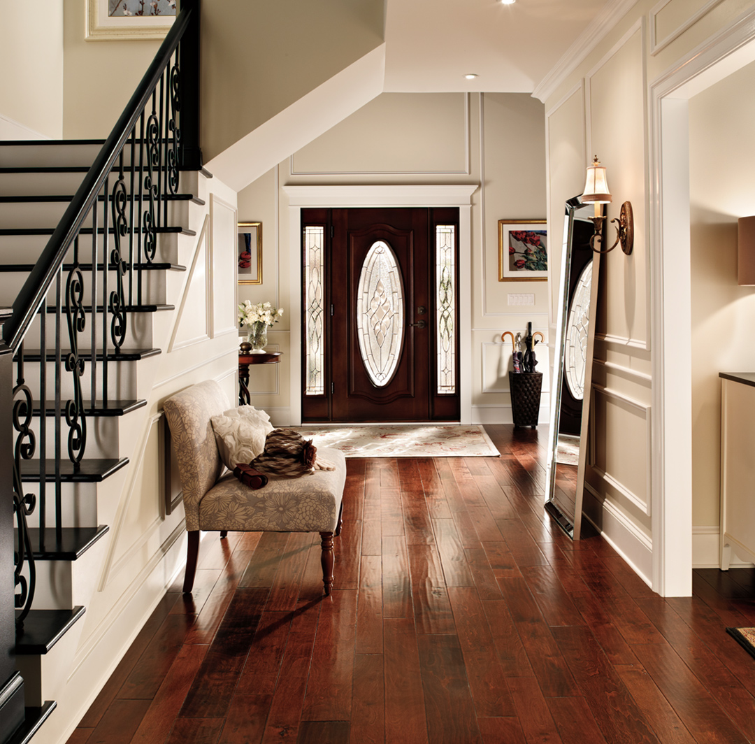 Hallway with stairs inspiration with white walls, white trim, wooden door, small image.