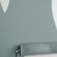 Painting a wall with a paint roller