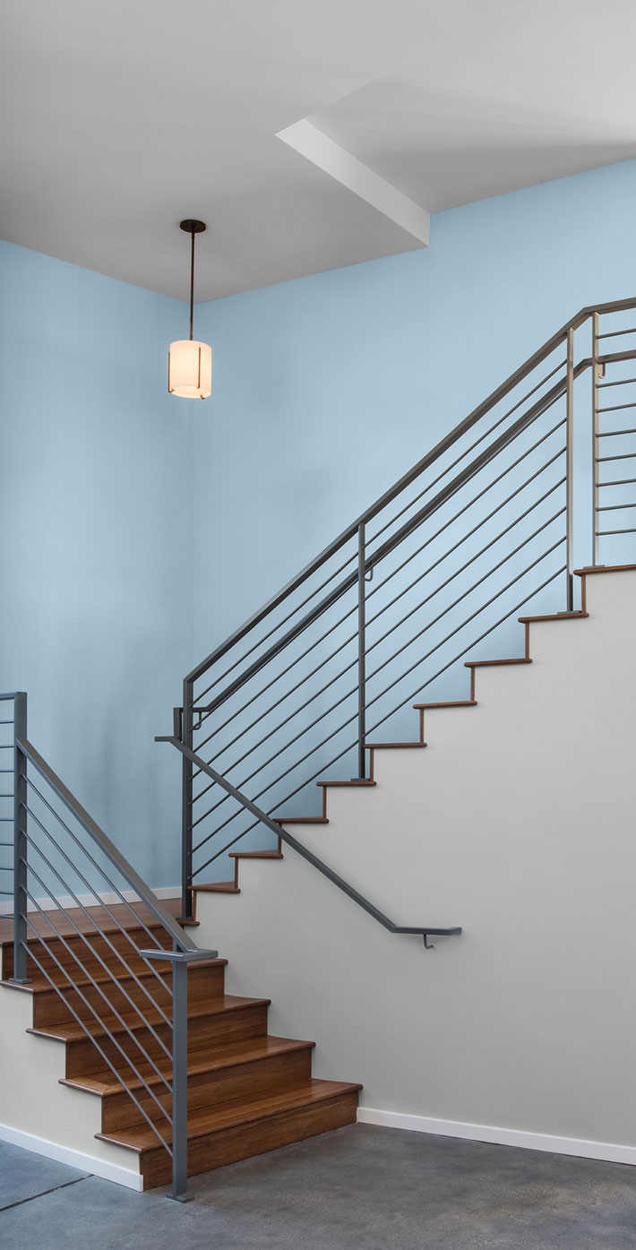 An office stairway with walls painted in a light soft blue color.
                After Rain M520-2
                