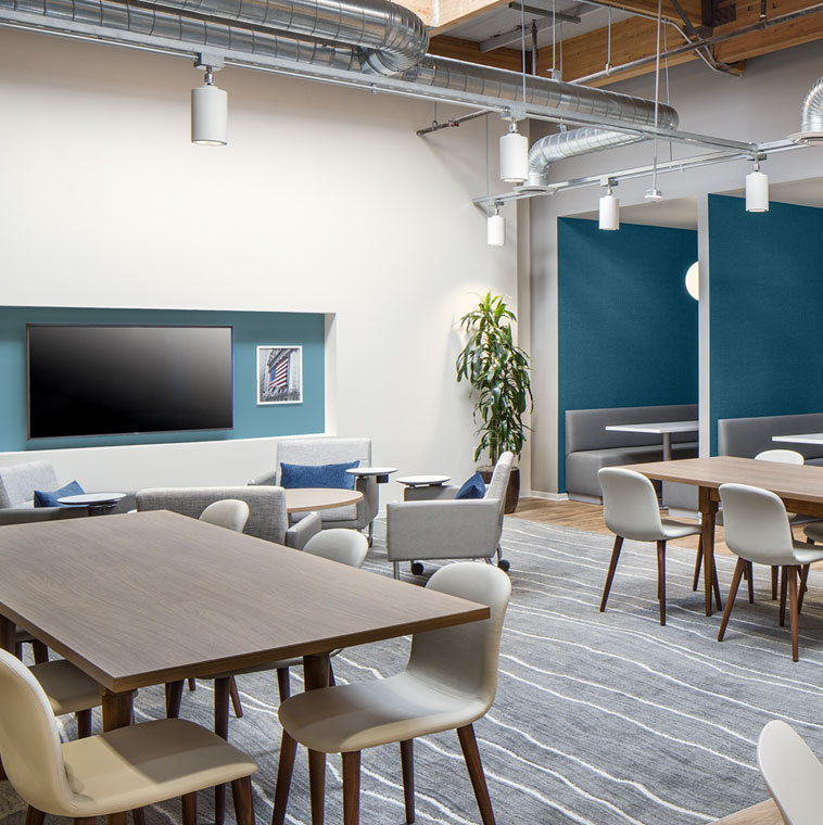 An office break area with chairs and tables. 
Explorer Blue M470-5
