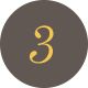 Dark circle with gold colored number 3