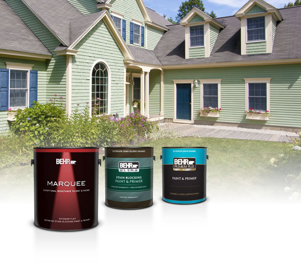 Three cans of Behr Exterior Paint with a pale green house in the background