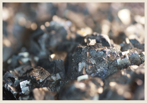 A close up image of gray metal minerals. 