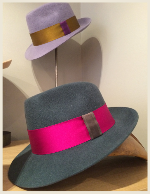 A frame with two custom hats made in Paris.