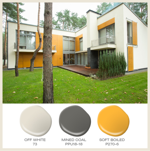 A large modern exterior with bright yellow panel accents. 