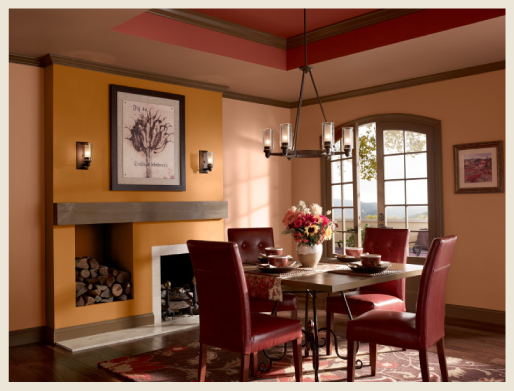A Mediterranean style dining room featuring warm tones paint colors.