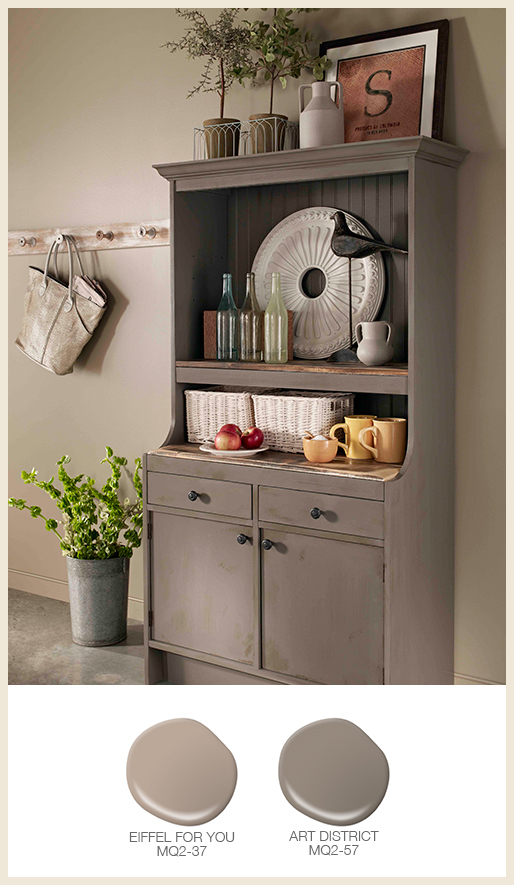 A tone on tone kitchen wall with a gray hutch. 