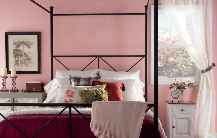 A bedroom painted in the color She Loves Pink.