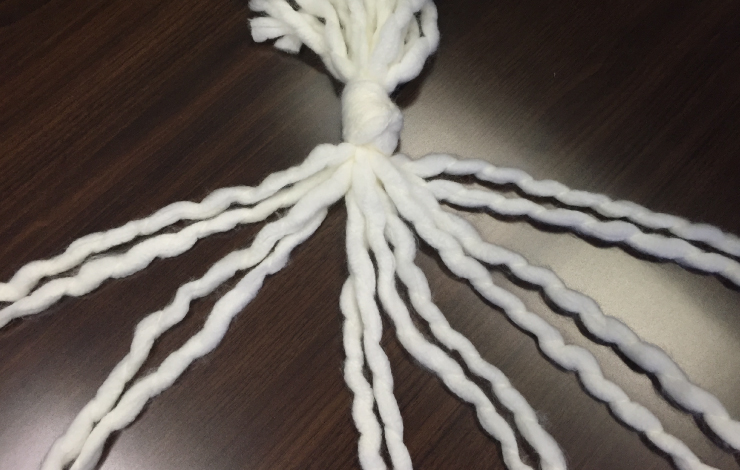 White yarn with strands spread out.