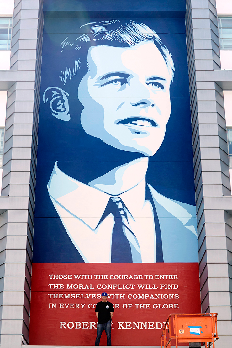 A mural on the side of a building of Robert F. Kennedy.
