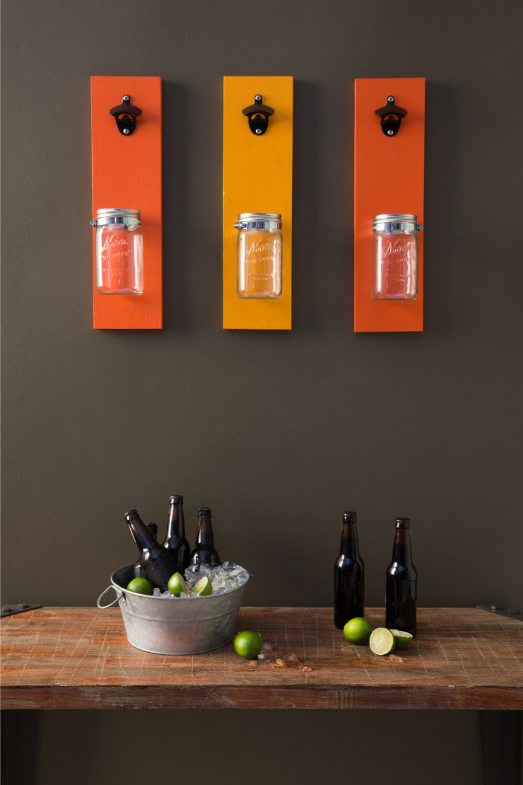 Bottle openers mounted to wall. 
