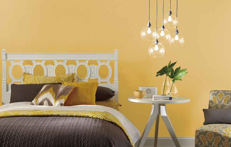 Bedroom with walls painted in Lemon Burst.