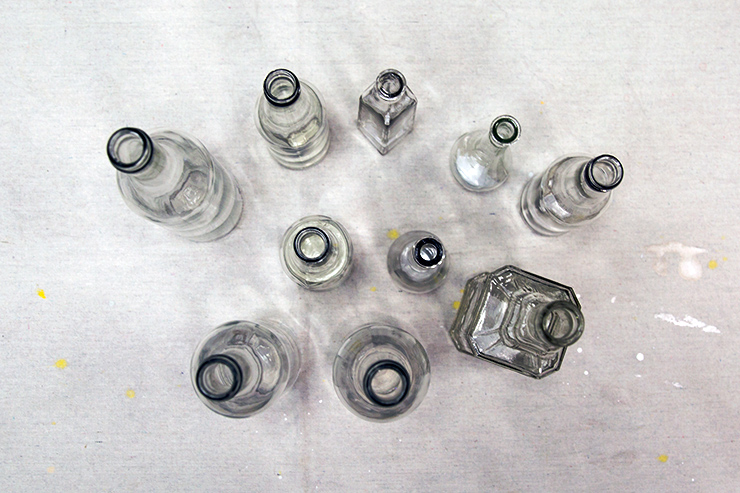 Top view of multiple shaped and size empty glass jars.