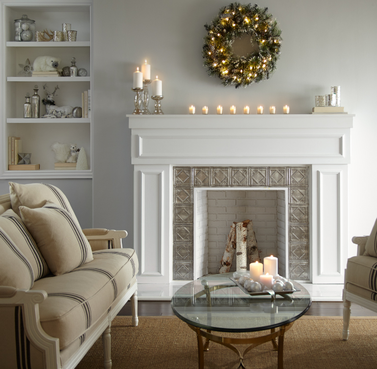 A living room with a fireplace decorated in cream and beige colors. The walls are painted in Close Knit.