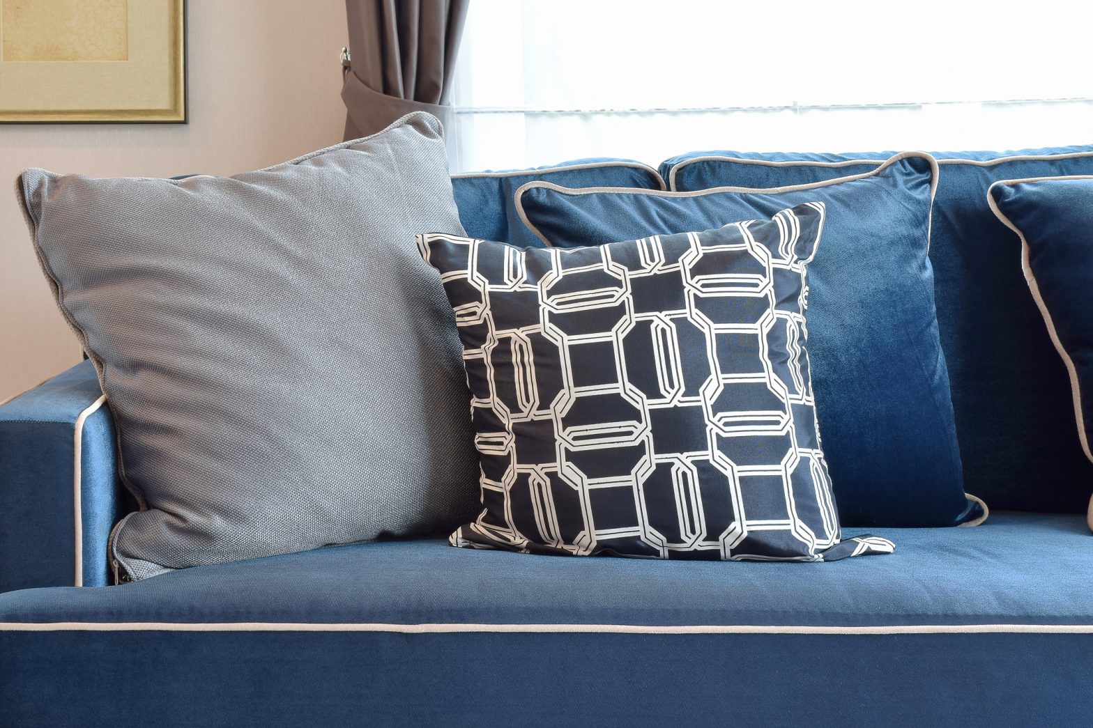 gray and blue pillow setting up on classic sofa Colorfully BEHR
