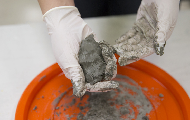 forming a shape with the wet cement