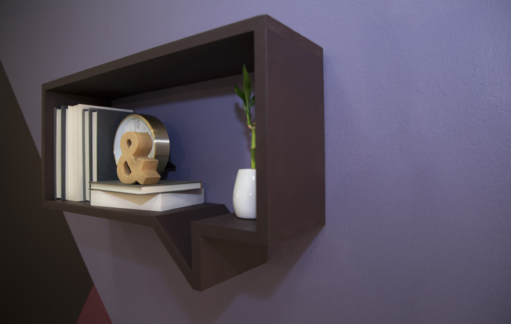 A side angle of the thought quote shaped bookshelf.