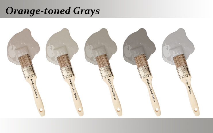 Five paint brushes dipped into paint drops that are Orange-toned grays colors.