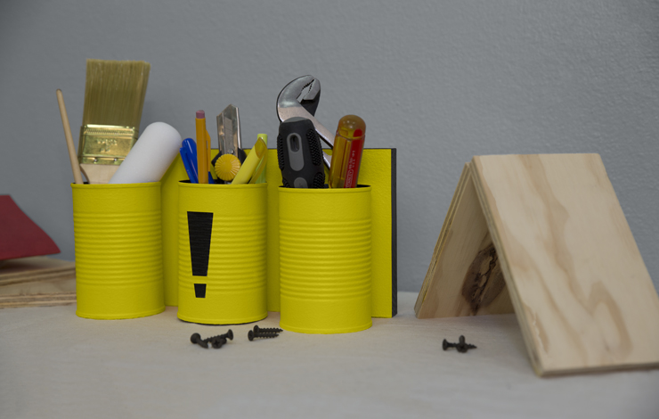 A bright yellow table-top tool organizer.