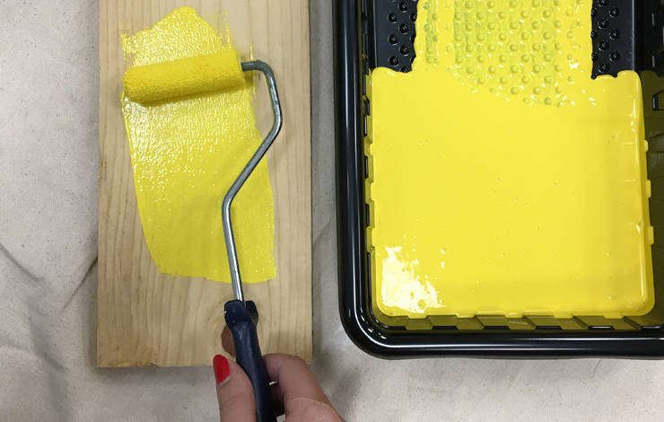 Painting board with bright yellow paint.