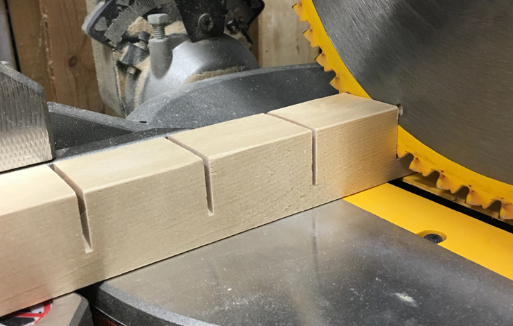 Cutting slots into wood board.