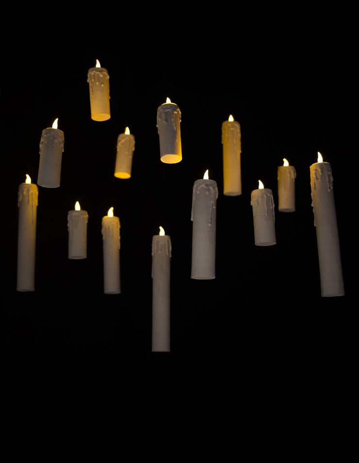 Flameless candles floating against a black background.