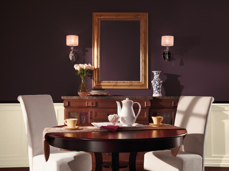 A small dining area for two with the walls painted in Nocturne Shade.